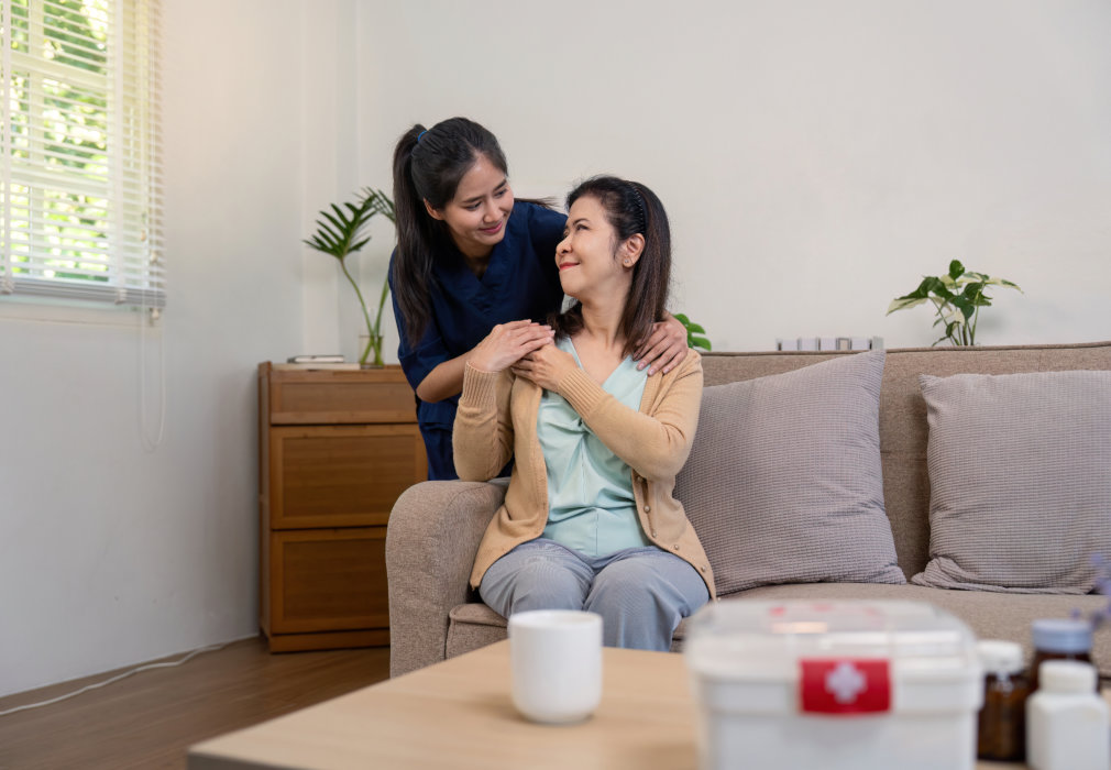 A woman giving a shoulder massage to another woman