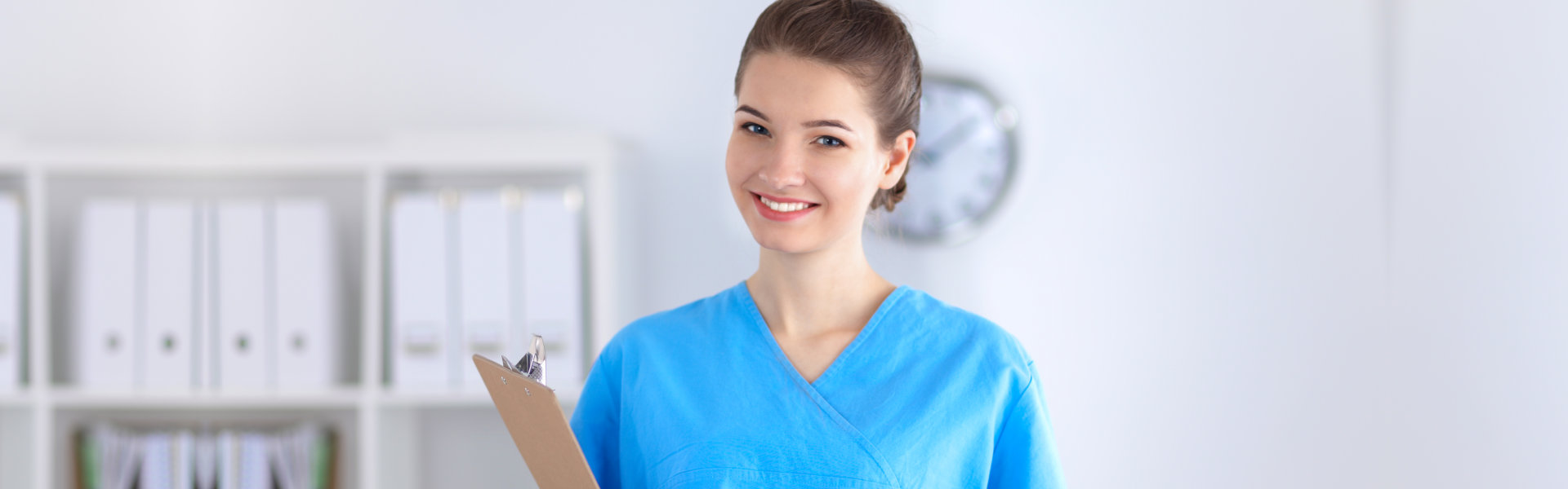 carer holding a clipboard